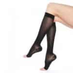 Person wearing black Knee High Compression stockings