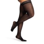 Woman wearing thigh high compression stockings