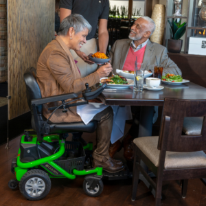 Woman on a mobile scooter in a restaurant- Copper Star Home Medical Supplies