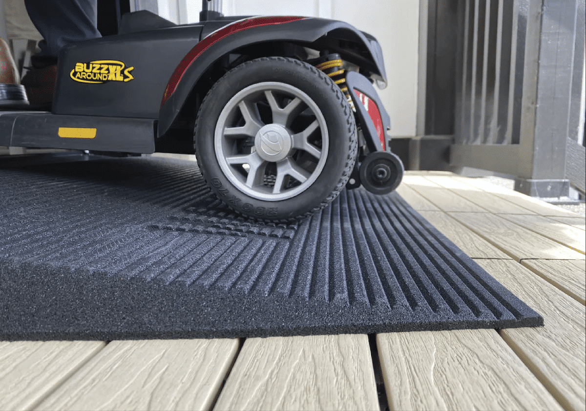 An angled entry mat that allows a mobility scooter to easily enter and exit the home